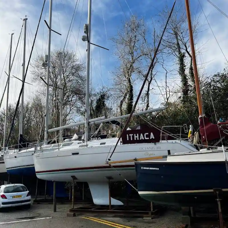 Sailing Yacht Ithaca image in Mylor Harbour dry dock ready for maintenance work to prepare for sailing.